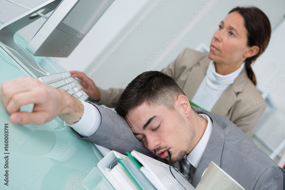 man sleeping at his working place head on the desk man sleeping at his working place head on the desk