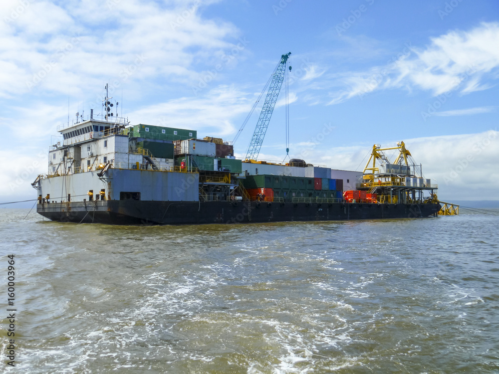 Naklejka premium The cargo ship with the crane, the top view. Pipelaying barge.