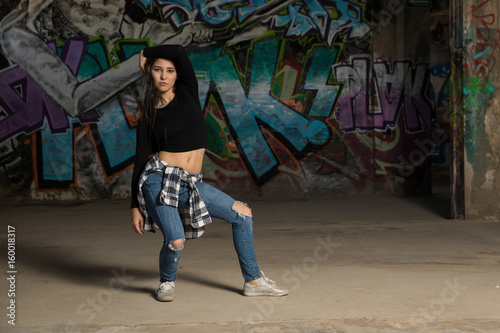Female urban dancer trying out some moves © AntonioDiaz