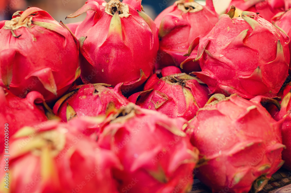 Exotic tropical fruit, dragon fruit or pitaya display for sell in market Exotic tropical fruit, dragon fruit or pitaya display for sell in market