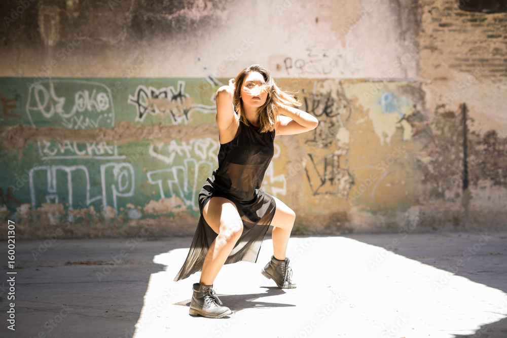 Strong female dancer during a performance Strong female dancer during a performance