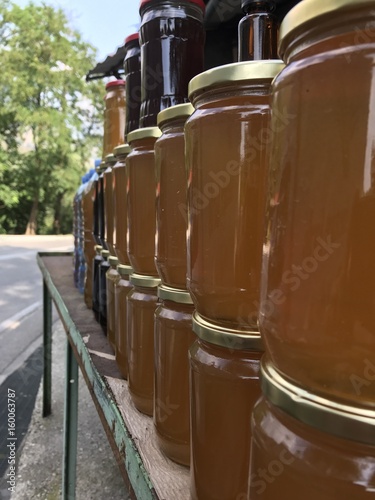 Honey jars view on a road of Albania