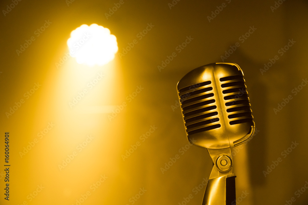 Microphone on the yellow dim light background and space for content | The  voice microphone Stock Photo | Adobe Stock