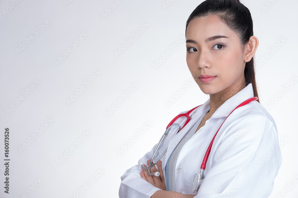 Confident smiling young female doctor posing with arms crossed. Portrait of medical staff, physician or practitioner on white background Confident smiling young female doctor posing with arms crossed. Portrait of medical staff, physician or practitioner on white background
