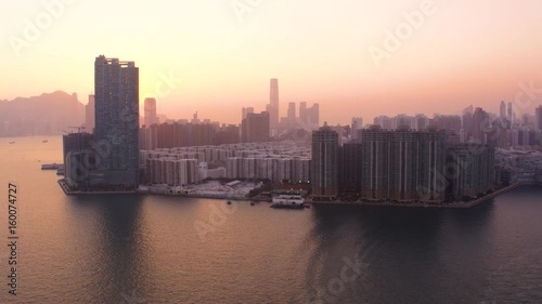 Hong Kong Aerial v21 Flying over Kowloon Bay with cityscape sunset views. photo