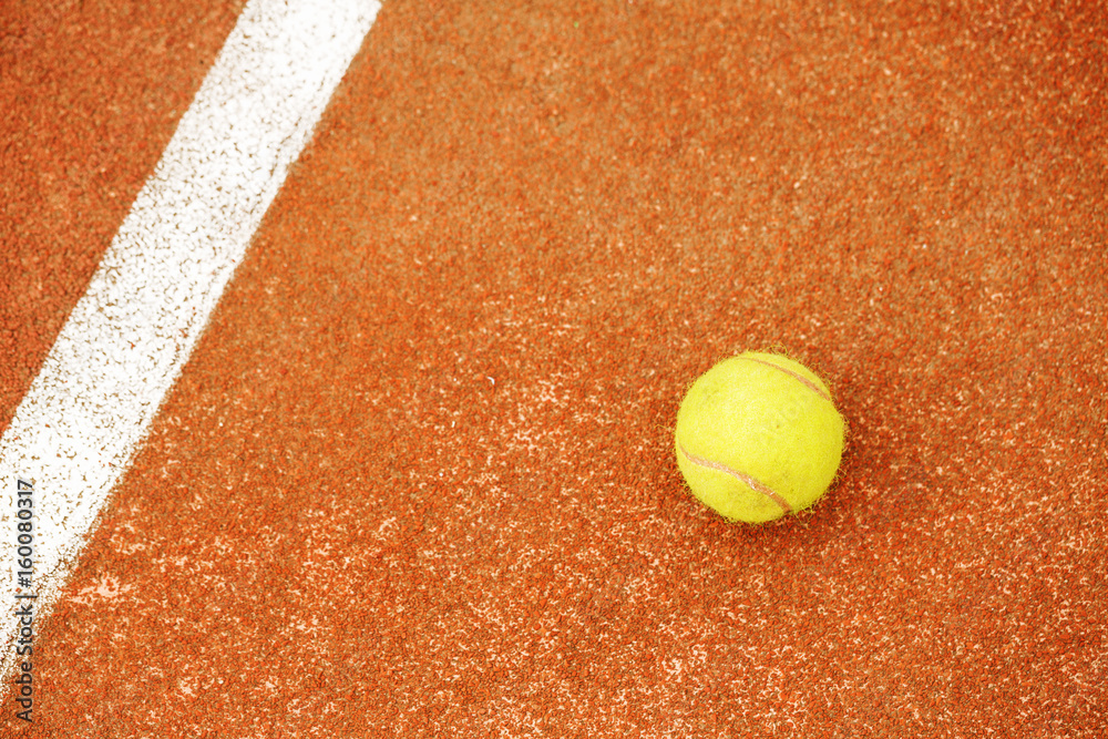 Ball on tennis court background