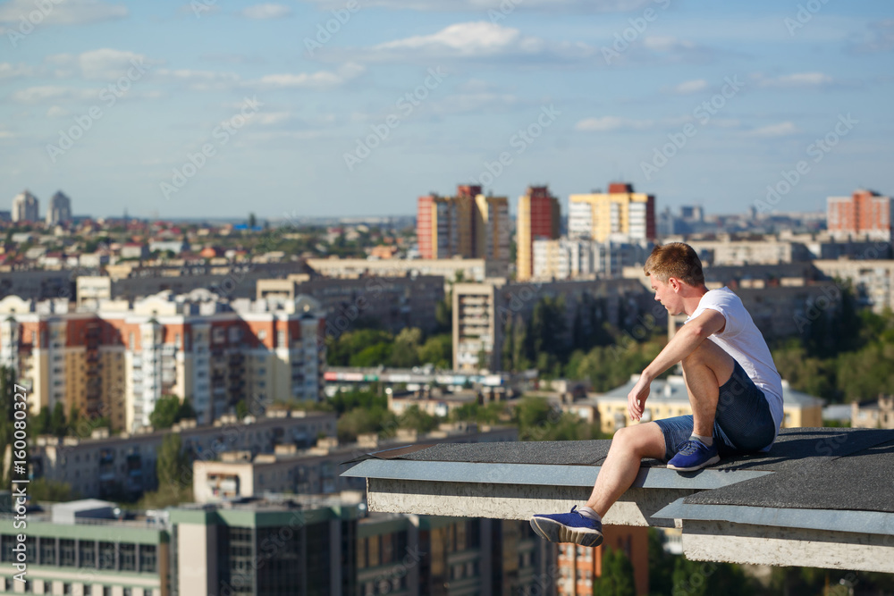 Roofer at the edge of the roof