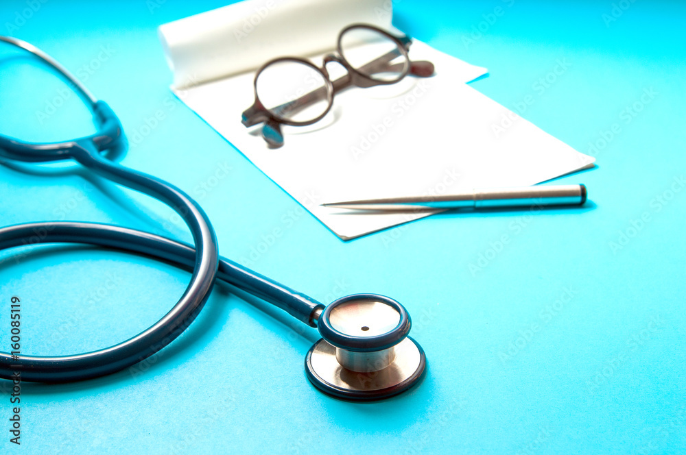 stethoscope, tablet pc on blue color background. Medical technology concept. stethoscope, tablet pc on blue color background. Medical technology concept.