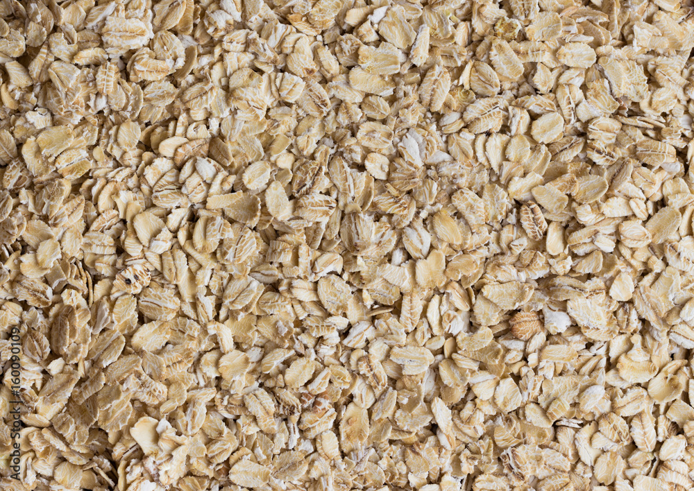Top view oat flakes or oatmeals for background and texture. Rolled oat is clean food for health lover people. Prepare oat flakes for bakery or cooking. Natural organic food in natural style concept. Top view oat flakes or oatmeals for background and texture. Rolled oat is clean food for health lover people. Prepare oat flakes for bakery or cooking. Natural organic food in natural style concept.