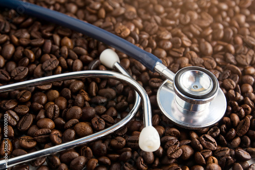 coffee beans and stethoscope in concept Health of coffee drinkers, quality of coffee