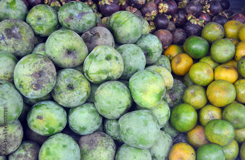 Fruit of mango, citrus fruit, and mangosteen fruit in one frame