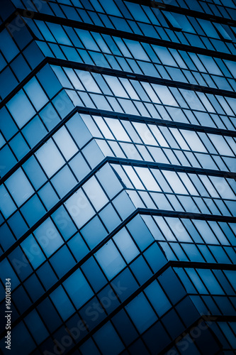 detail shot of modern architecture facade business concepts in blue tone shot in city of China.