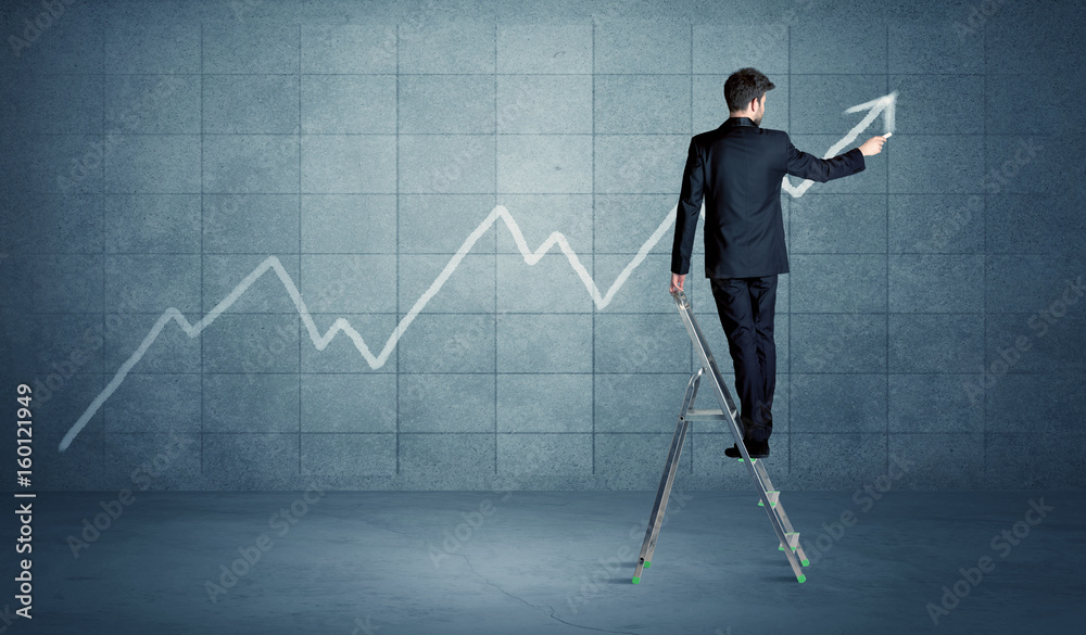 Fototapeta premium Man drawing line from ladder
