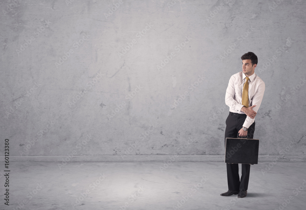 Young businessman standing confused Young businessman standing confused