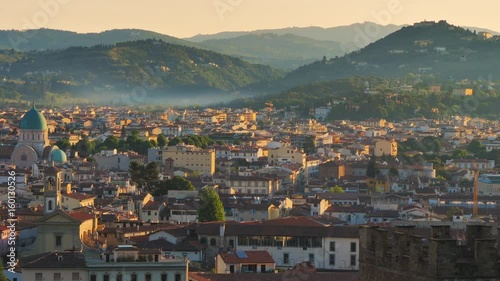 fiesole hill at sunrise seen from florence city