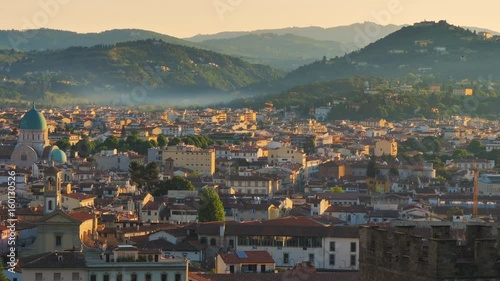 fiesole hill at sunrise seen from florence city photo