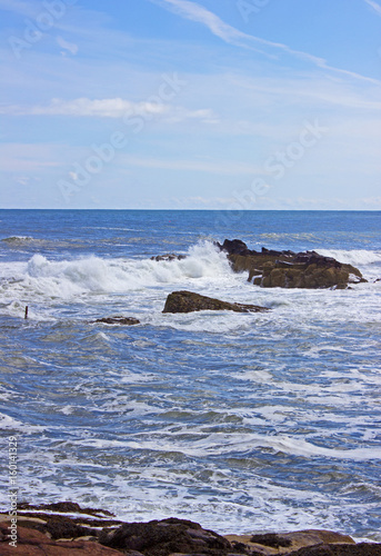 Waves breaking at rocks