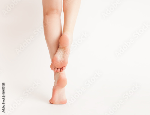 Bare feet on a white background © ekramar