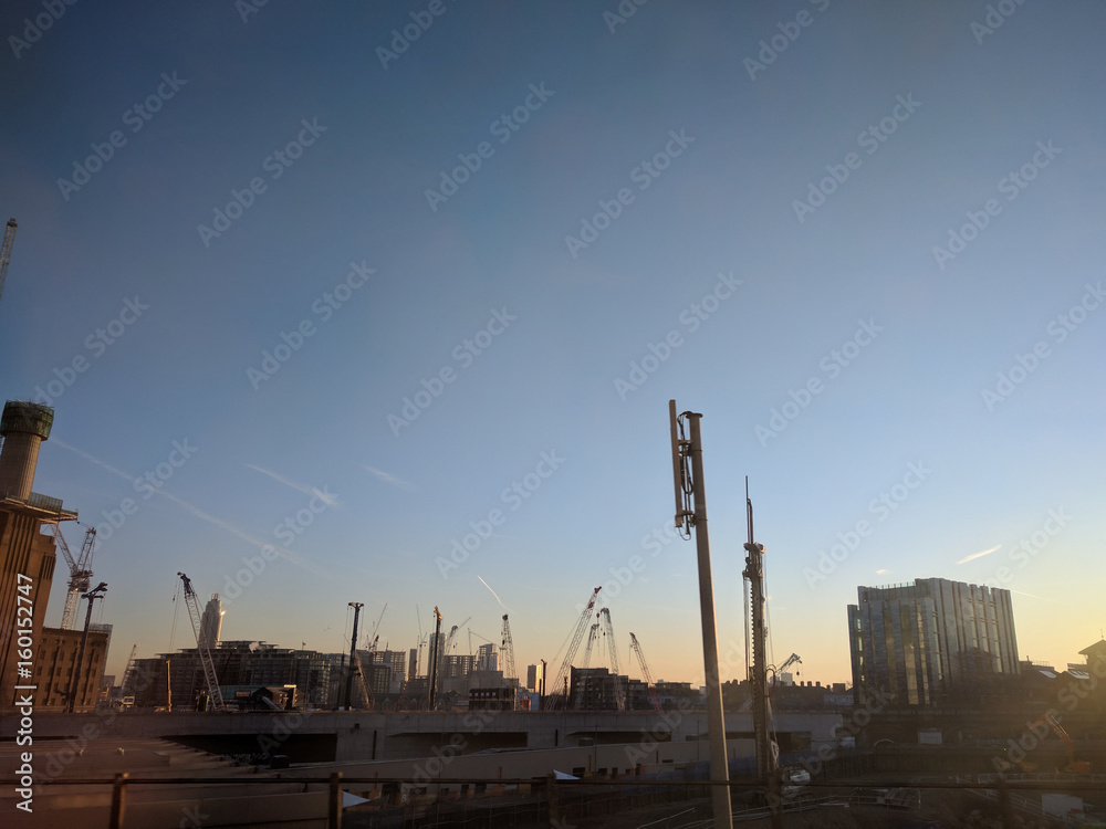 View of buildings and cranes in the city, london uk