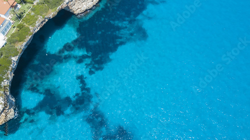 Aerial landscape of the beautiful bay of Cala Mandia with a wonderful turquoise sea, Porto Cristo, Majorca, Spain photo