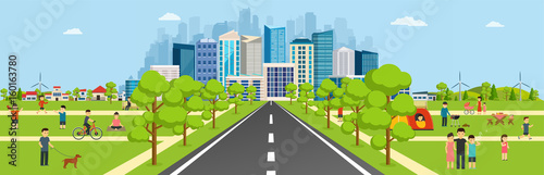 Public park with a road leading to a modern big city with skyscr