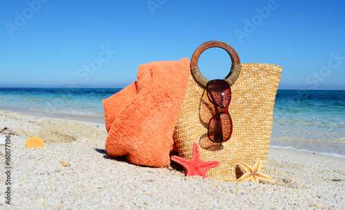 Fototapeta Naklejka Na Ścianę i Meble -  Bag and sunglasses on the beach