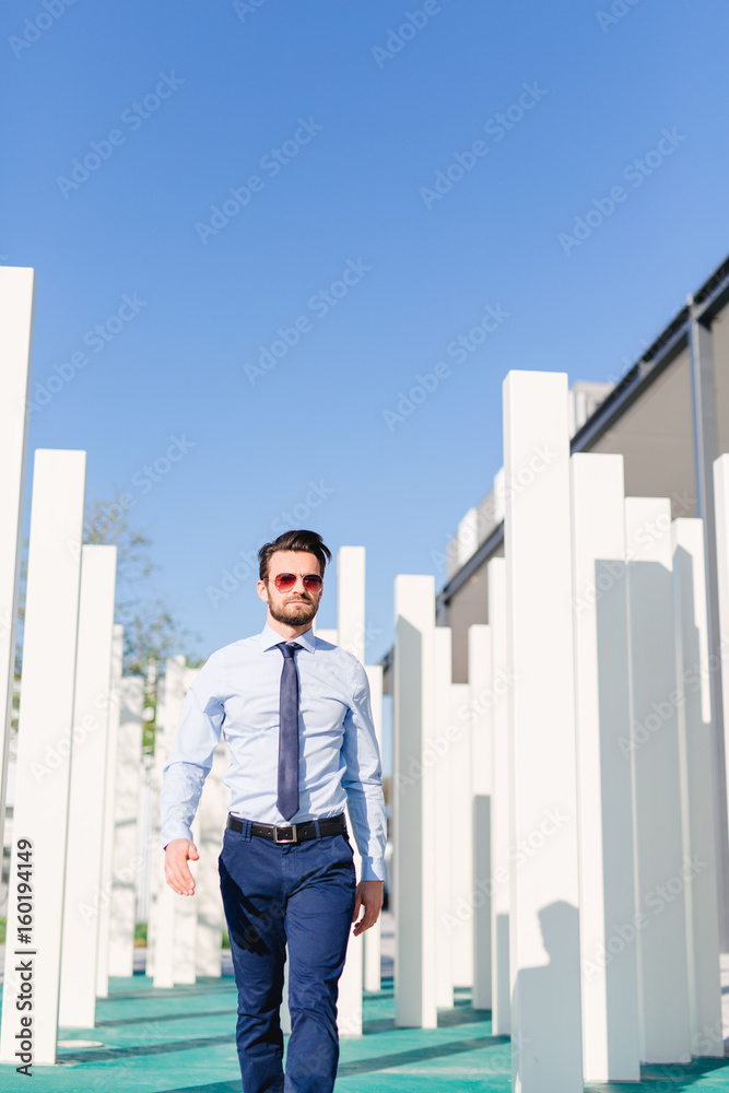 Business man with tie - blue sky and white stayer Business man with tie - blue sky and white stayer