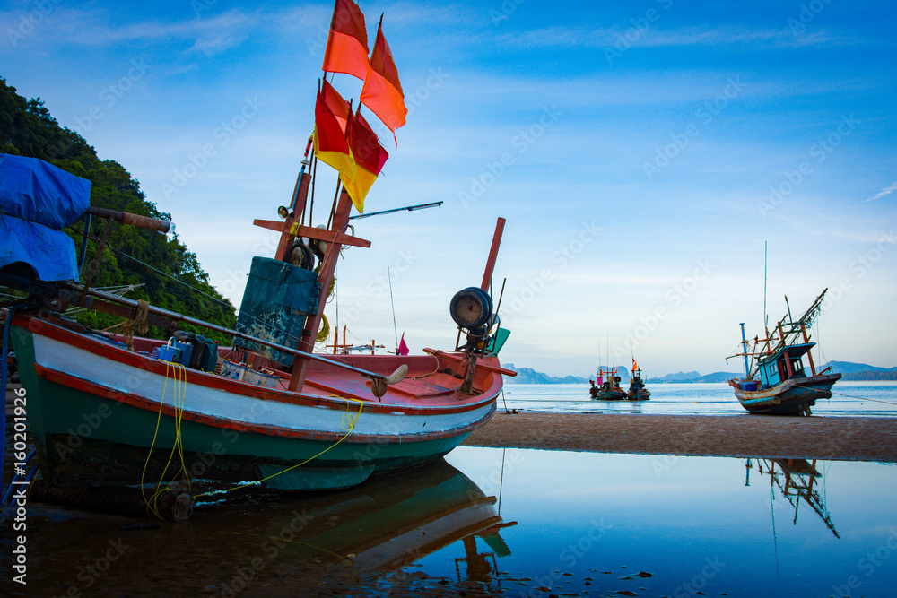 fishing boat on the beach seascape in Thailand dark tone