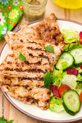 Grilled marinated turkey with fresh vegetables