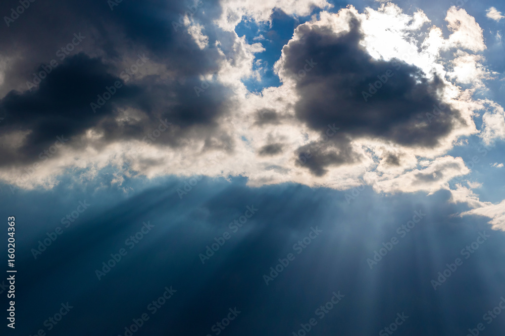 Fototapeta premium Heavy leaden sky with breaking sun rays