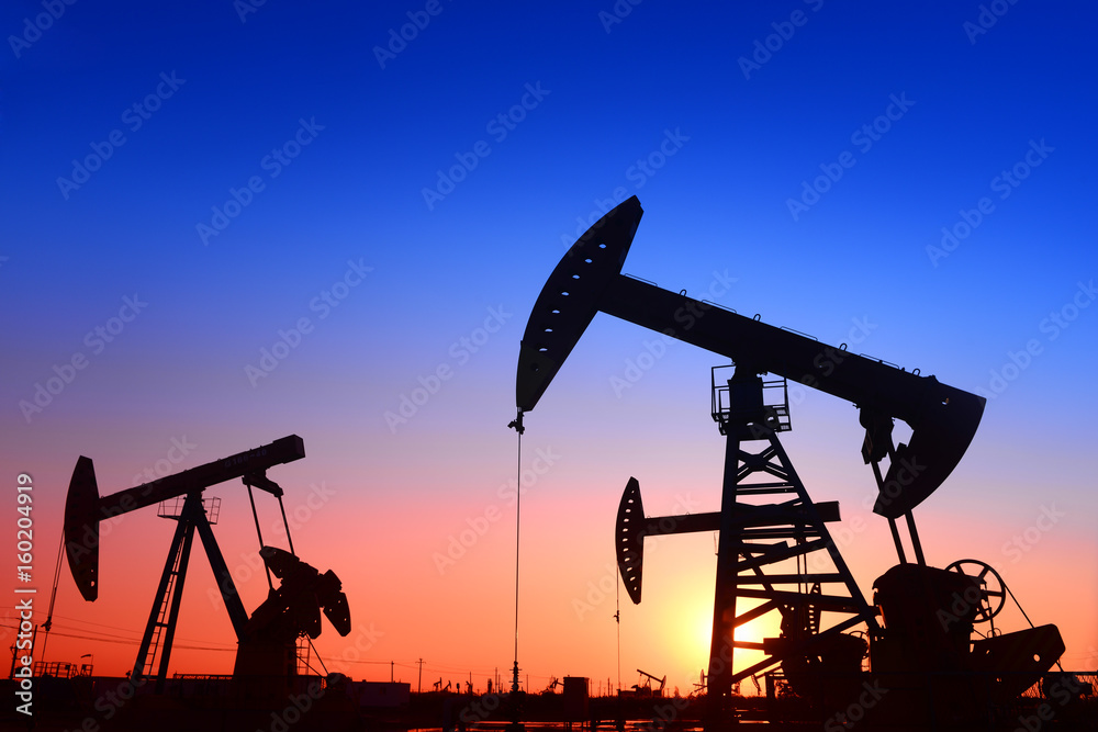 Pumping unit is working, under the sunset Pumping unit is working, under the sunset