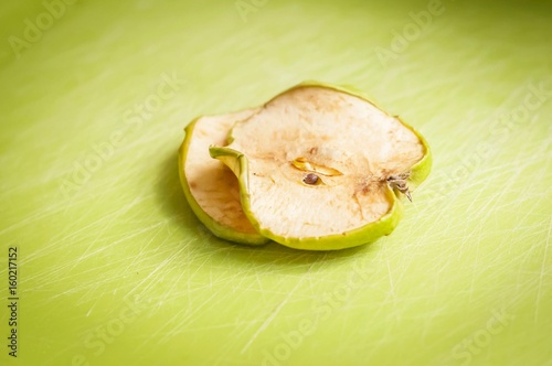 Two dry green apple slices stock image. photo