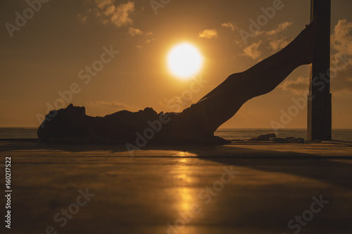 Girl enjoying the ocean tropical sunset / sunrise.