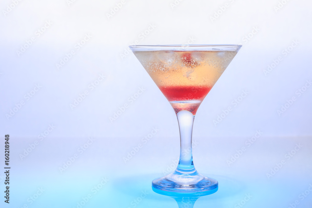 cocktail in a glass on a beautifully illuminated background cocktail in a glass on a beautifully illuminated background