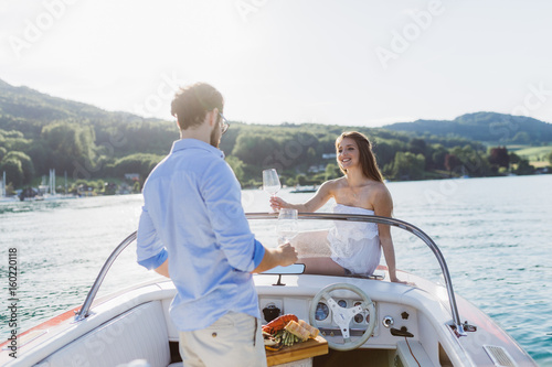 Couple having a glass of wine on a boat