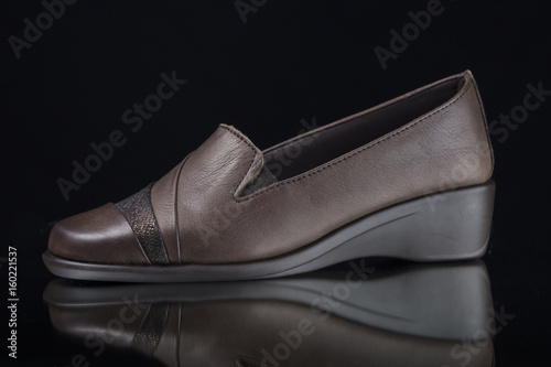 Female Brown Shoe on Black Background, Isolated Product, Top View, Studio.