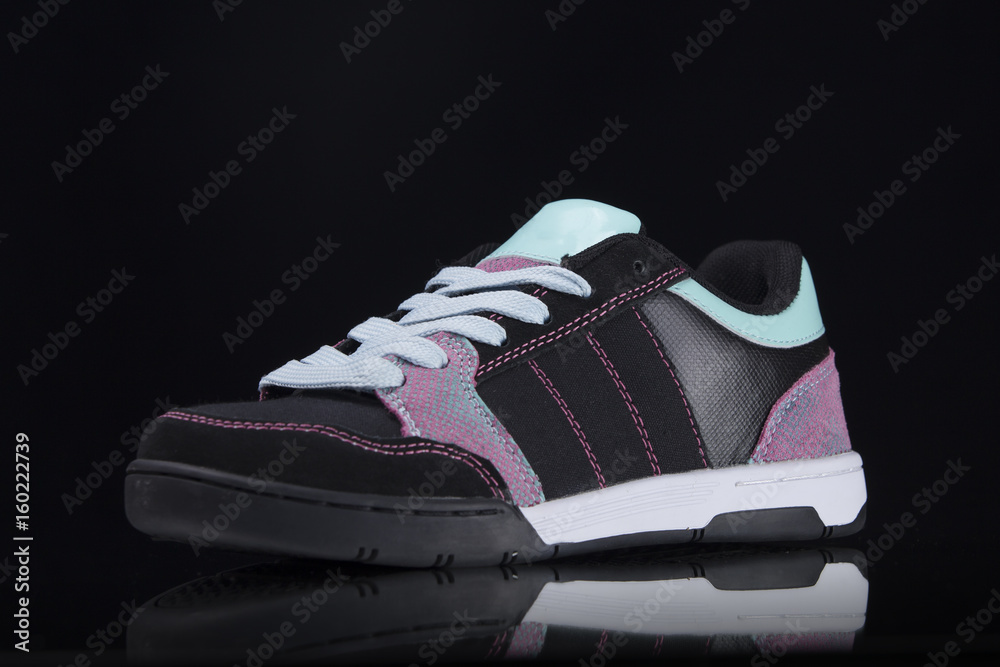 Sneaker on Black Background, Isolated Product, Top View, Studio. Sneaker on Black Background, Isolated Product, Top View, Studio.