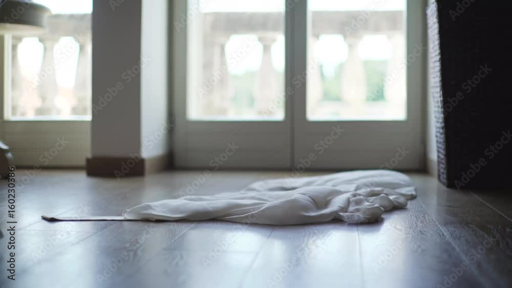 Unrecognizable woman getting undressed in bedroom. 4K