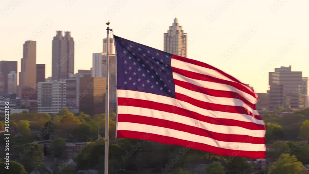 Atlanta Aerial v266 Flying low closeup around American flag with full cityscape views at sunset