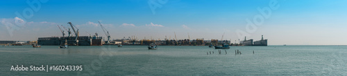 Panorama of large dry dock on sunny overcast afternoon © Baan Taksin Studio