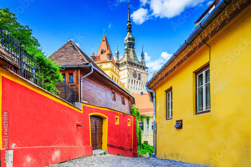 Obraz na płótnie Sighisoara, Romania. Medieval street with Clock Tower in Transylvania. w salonie