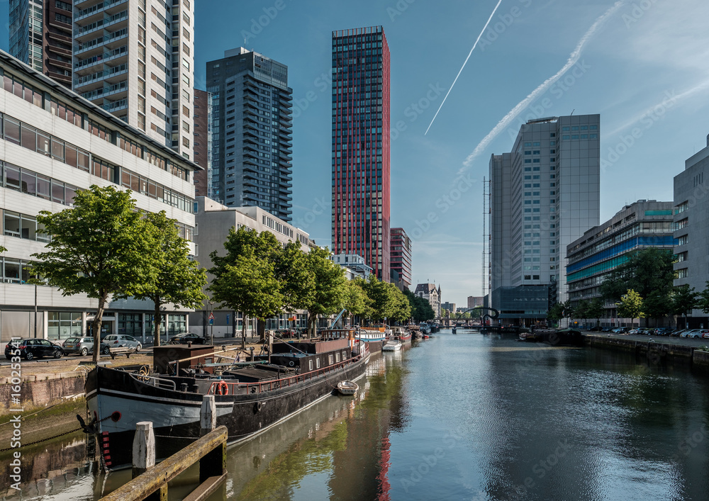 Rotterdam city cityscape skyline with water canal in front, South Holland, Netherlands.