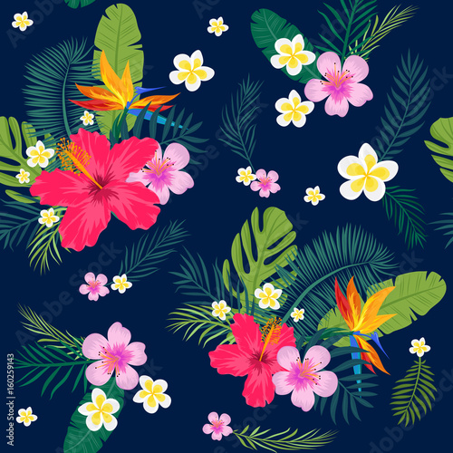 Tropical seamless pattern with palm leaves and flowers