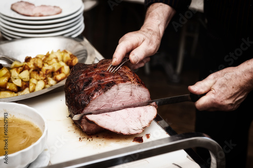 Chef is cutting beefsteak, toned