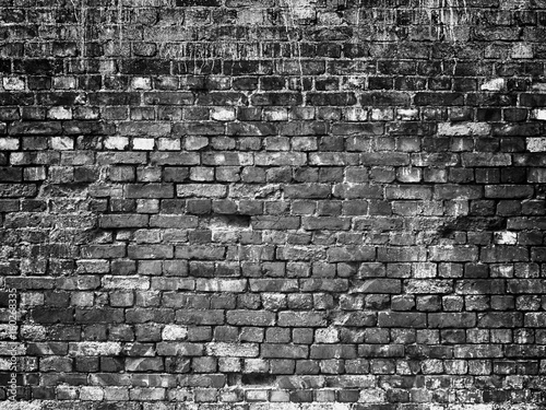 texture of a black brick wa...
