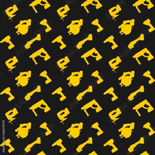 Seamless pattern yellow power tools on the dark background photo