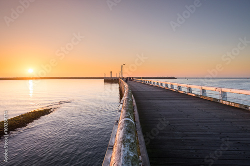 Sunset over the pier of Oostende, Belgium.