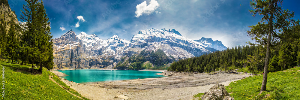 Amazing tourquise Oeschinnensee with waterfalls in Swiss Alps, Kandersteg, Switzerland Amazing tourquise Oeschinnensee with waterfalls in Swiss Alps, Kandersteg, Switzerland