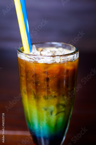 color cocktail on a dark background photo