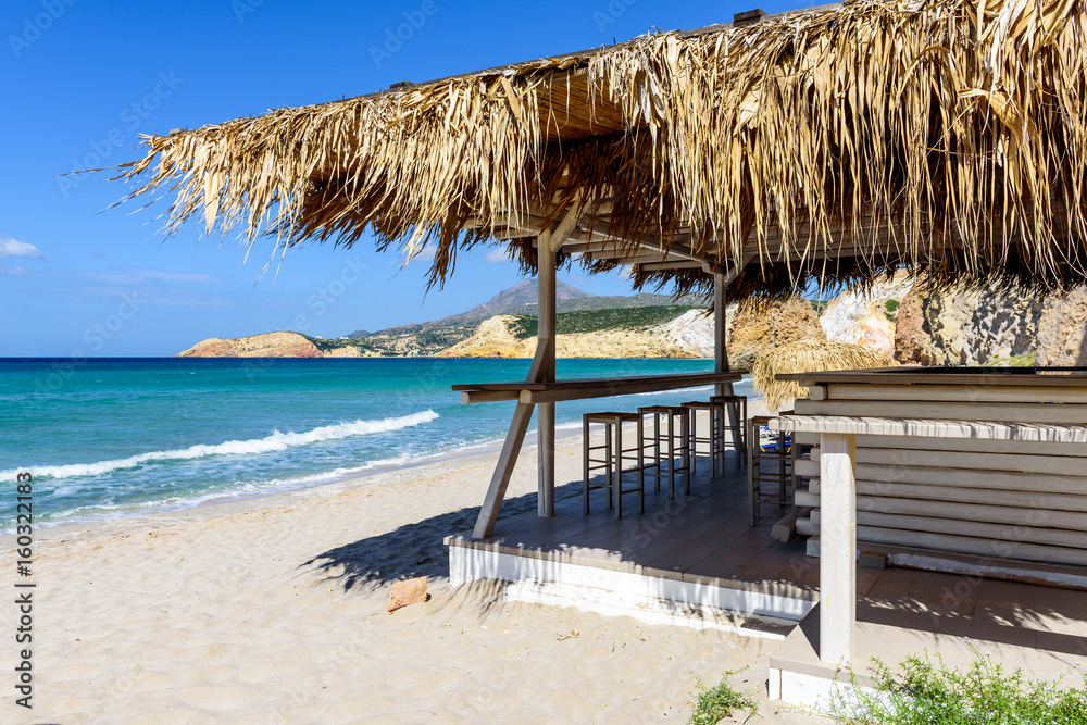Greek tavern on the sea coast. Firiplaka beach located on the south coast of Milos. Cyclades, Greece.	